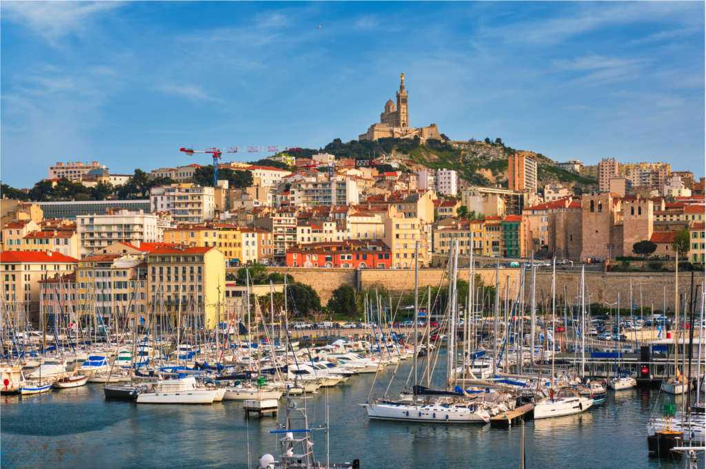 Aerial view of the old port of Marseille, giving sight to the splendid cathedral of Notre Dame de la Garde.